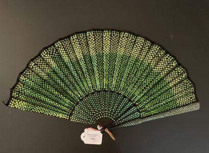 null Green sequins, ca. 1920

Folded fan, the leaf in black fabric embroidered with...