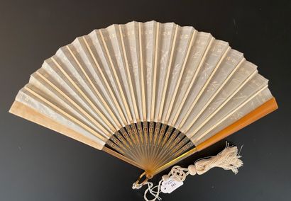 null Golden laurels, circa 1910

Folded fan, the cream silk leaf embroidered with...