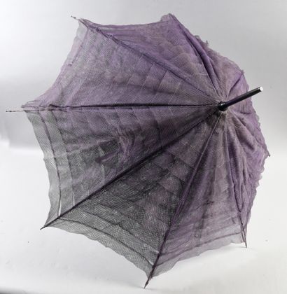null 
. Meeting of five umbrellas and parasols, 1900- 1950 approximately, mainly...