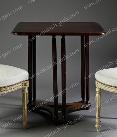 null TEA TABLE.
Rectangular shape, mahogany top rounded at the corners, resting on...