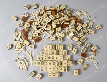 null MAH-JONG GAMES.
Comprising 148 bamboo and ox bone pieces (tiles) carved with...