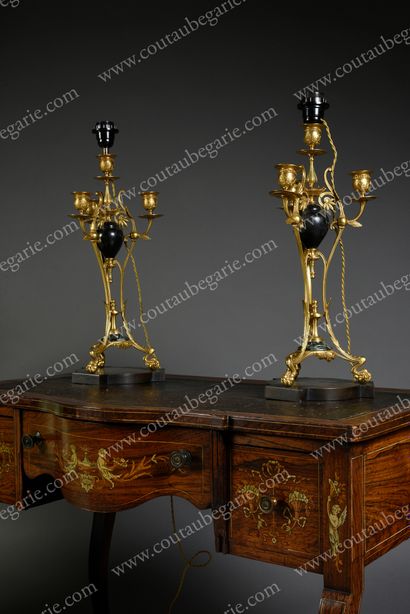 null Pair of candlesticks.
In gilt bronze, with four lights, electrically mounted,...