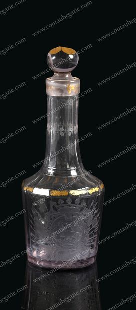 null SMALL LIQUEUR DECANTER. 
 Blown and cut glass, with a cutaway decoration, engraved...