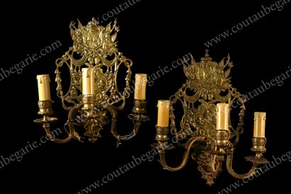 null Pair of wall lights.
In gilt bronze, with three arms of light, decorated with...