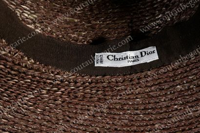 null BIG HAT.
Signed Christian Dior Paris, in brown braided straw, hemmed with a...