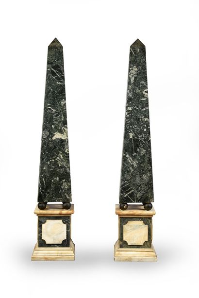 null A pair of obelisks in green marble veneer, standing on a quadrangular base moulded...
