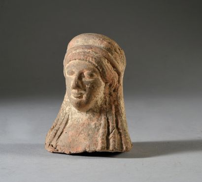 null Bust of archaic Korah with parotid hair. Beige clay. Traces of white slip. Greek...