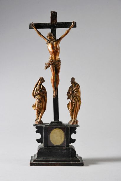 Calvary Christ in carved wood, gilded and...