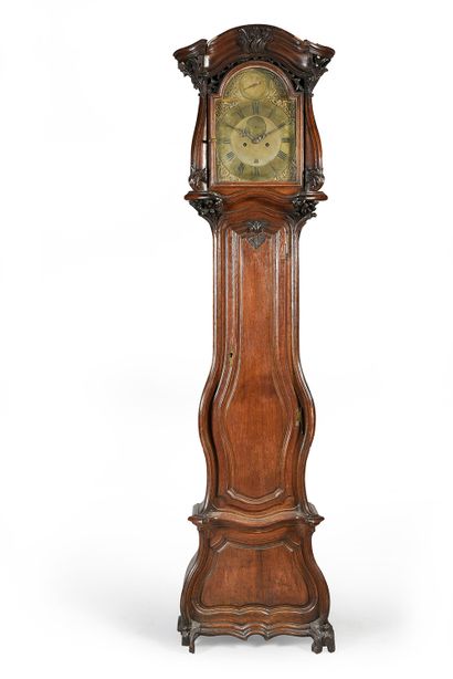 Parquet clock in moulded and carved oak....
