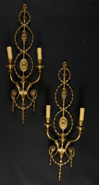 null Suite of four Adam style gilt metal sconces with two arms of light, decorated...