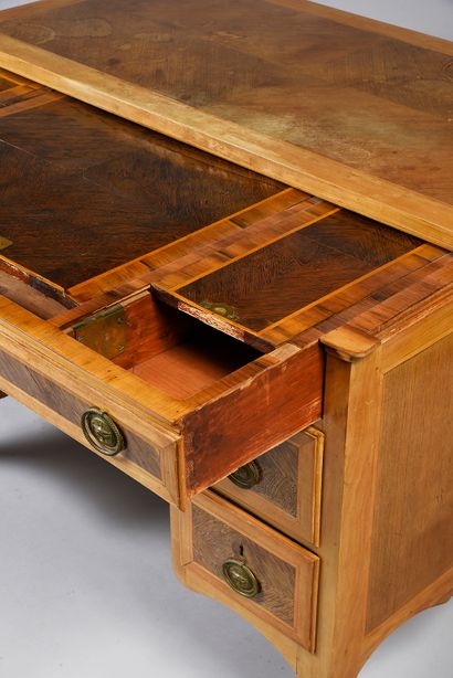 null A rosewood veneered pedestal desk with a large drawer in the front revealing...