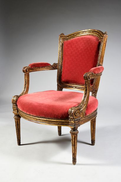 Large moulded, carved and gilded wooden armchair,...