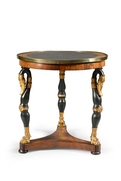 null A mahogany and mahogany veneer pedestal table, standing on three lion-shanked...