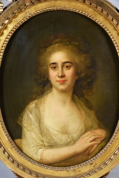 DANS LE GOÛT D'ANTOINE VESTIER Portrait of a young woman in bust.
Oval canvas
69...
