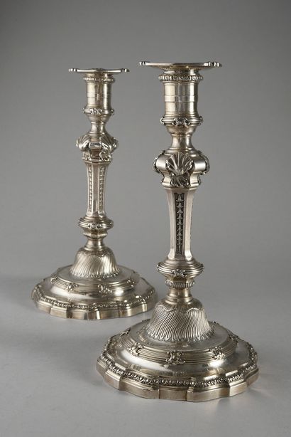 null Pair of silver torches, the base with double friezes of oves and rushes punctuated...