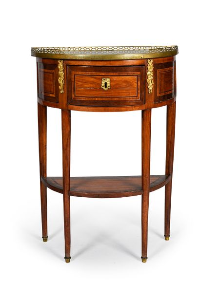 null Rosewood veneered ½ moon console in rosewood frames. Chased and gilt bronze...