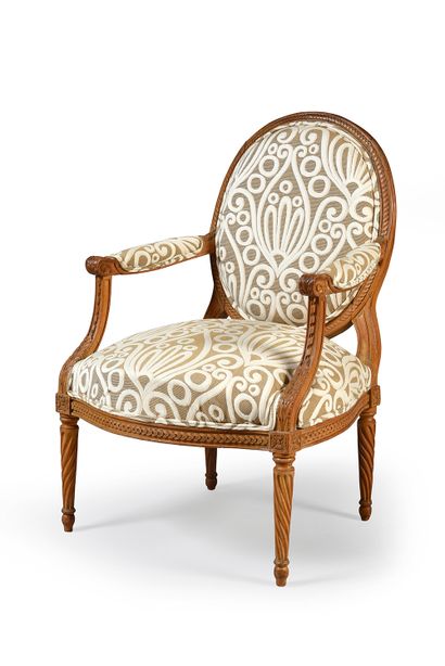 Moulded and carved wooden armchair, with...