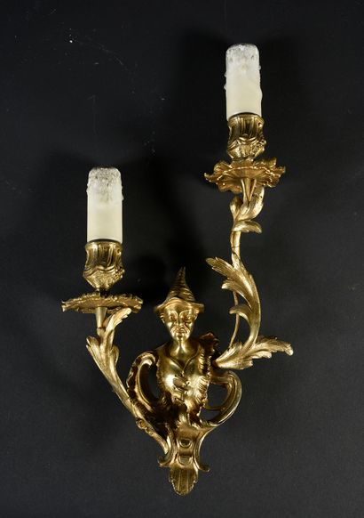 A pair of gilt bronze sconces with two branches,...
