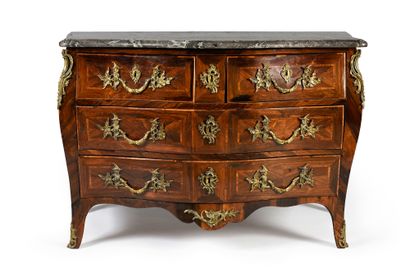 A rosewood veneered chest of drawers, opening...