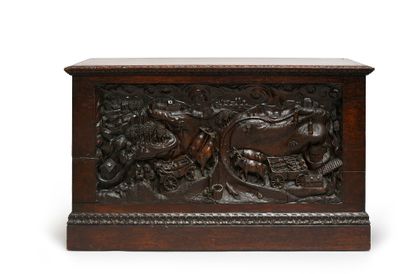 Walnut chest, the front carved with a scene...