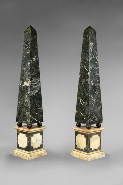 null A pair of obelisks in green marble veneer, standing on a quadrangular base moulded...
