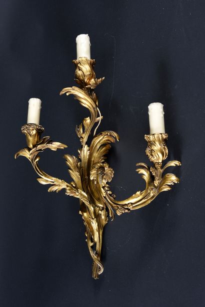 Pair of three-light chased bronze sconces....