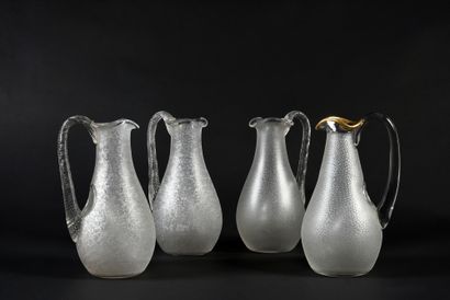 null Suite of 4 orangeade jugs in granite crystal, the handles twisted or with gold...