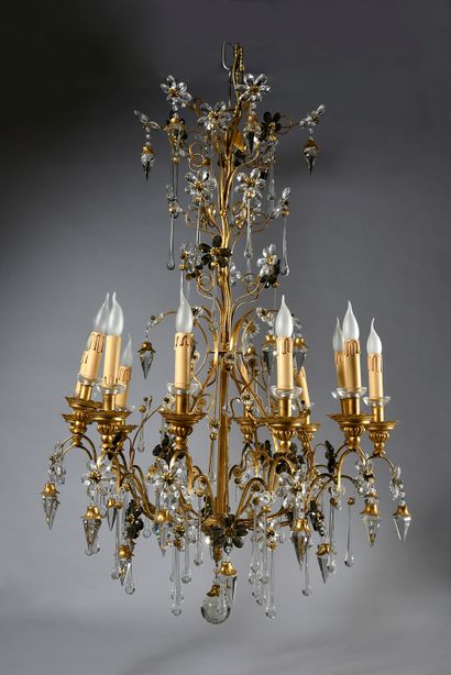 null Pair of 12-light wrought iron and gilded chandeliers, decorated with drops,...