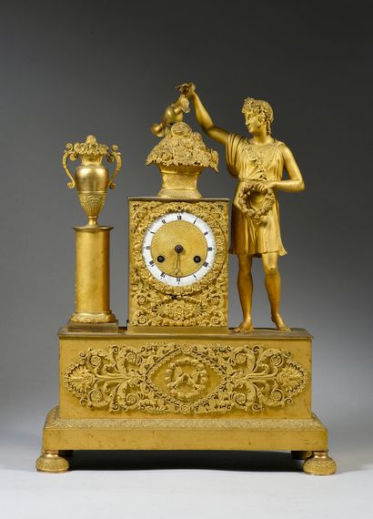 null 
A chased and gilt bronze clock with a gardener



H. 45 cm



Empire perio...