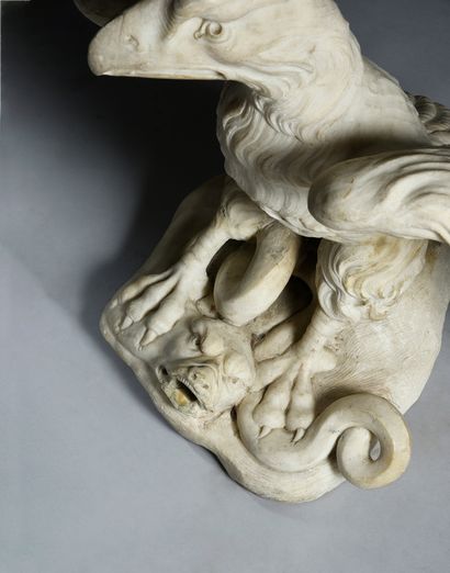 null Eagle in sculpted marble.
The eagle with spread wings holds in its claws a snake...