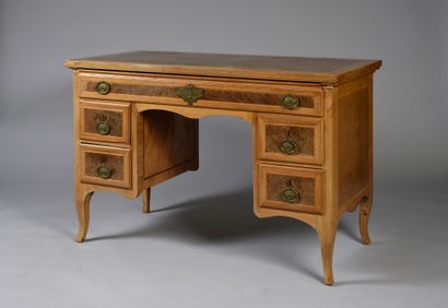 null A rosewood veneered pedestal desk with a large drawer in the front revealing...
