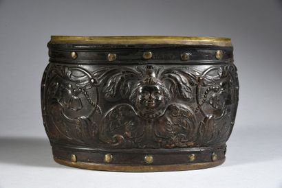 null An astonishing pressed horn bowl with a smiling cherub in foliage and flowers,...