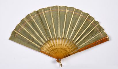 null Reading in the garden, circa 1910-1920
Small folded fan, the green silk leaf...