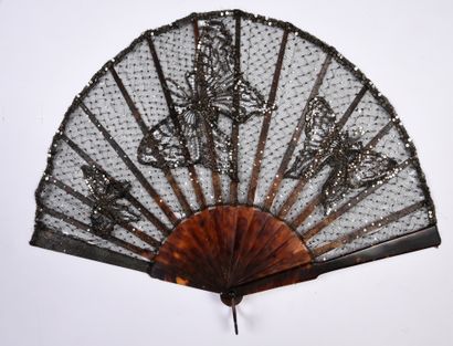 null Glittering butterflies, circa 1900
Folded fan, the black tulle leaf sown with...