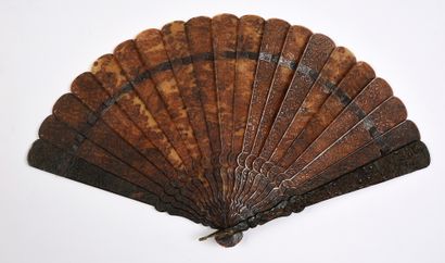 null In the garden, China, 19th century Broken type fan in brown tortoiseshell**...