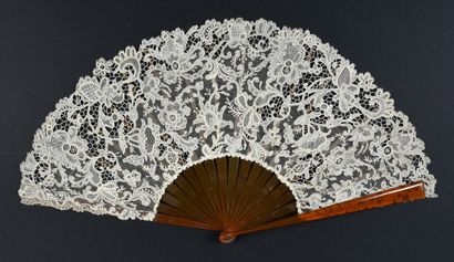 Flowery interlacing, circa 1900
Folded fan,...