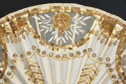 null Gilded chevrons, circa 1910
Folded fan, the ivory-colored silk leaf embroidered...