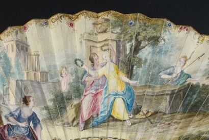 null The happy couple, circa 1750
Folded fan, the leaf in skin, mounted in English,...