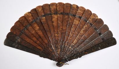 null In the garden, China, 19th century Broken type fan in brown tortoiseshell**...