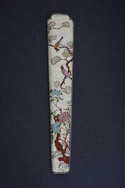  Fan case, China, 19th century In beige silk embroidered with two birds among flowering...