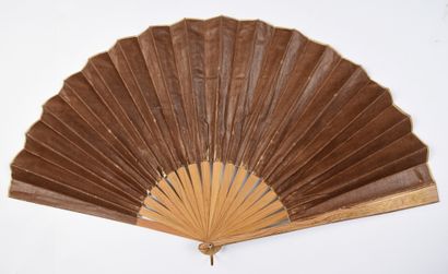 null The 1889 World's Fair
Folded fan, the sheet of fabric coated and printed in...