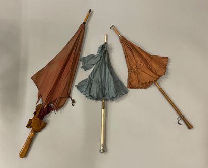 null A collection of parasols, late 19th-early 20th century, mostly with wooden handles...