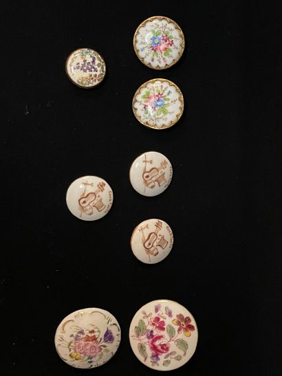 A set of eight painted porcelain buttons,...
