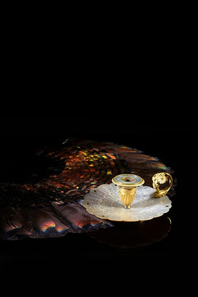 null Peacock feather candlestick
Gilt bronze hand candlestick with a white mother-of-pearl...