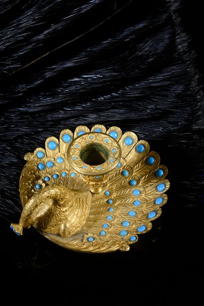 null Peacock candlestick
Gilt bronze hand candlestick decorated with enamel cabochons...