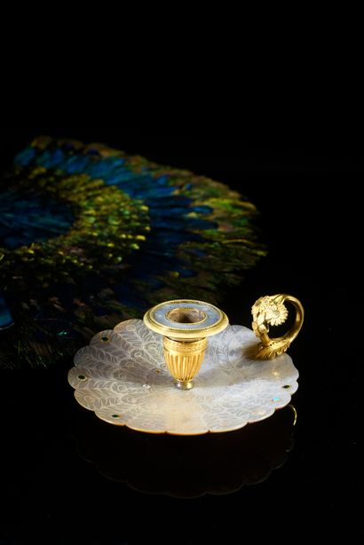 null Peacock feather candlestick
Gilt bronze hand candlestick with a white mother-of-pearl...