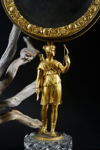 null An ormolu Psyche, the mirror is reversible and decorated with a finely engraved...