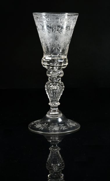 Translucent glass stem engraved with a wheel...