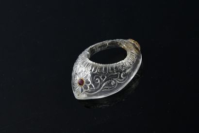 null A rock crystal archer's ring engraved with friezes, foliage and an eight-petalled...