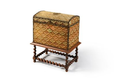 null Oak core chest, curved lid, upholstered in brown nail-stitch tapestry. The lid...